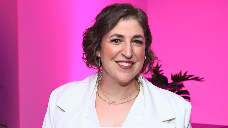 Mayim Bialik against pink background