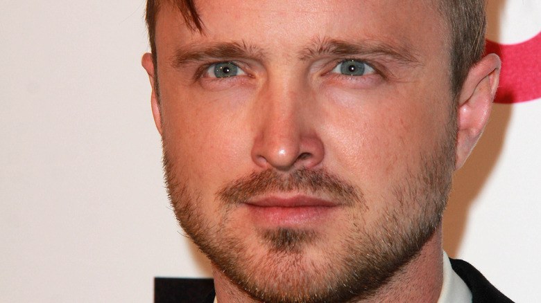 A close up of Aaron Paul at a movie premiere