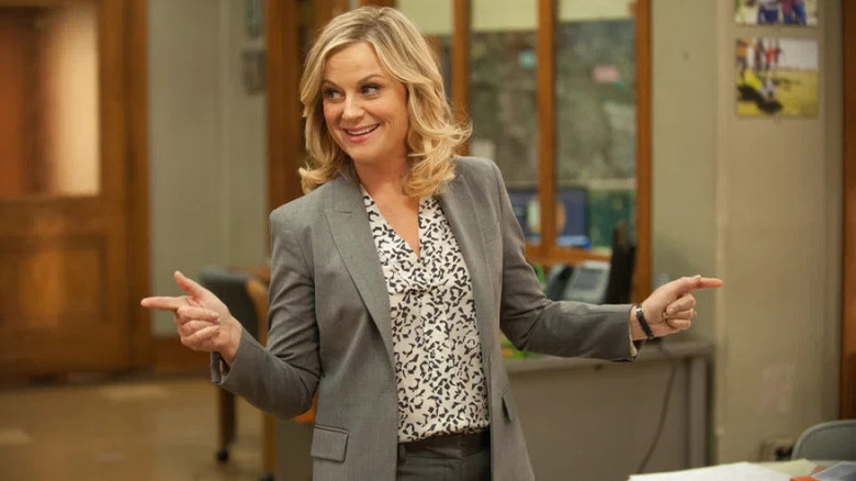 Leslie Knope in gray pantsuit