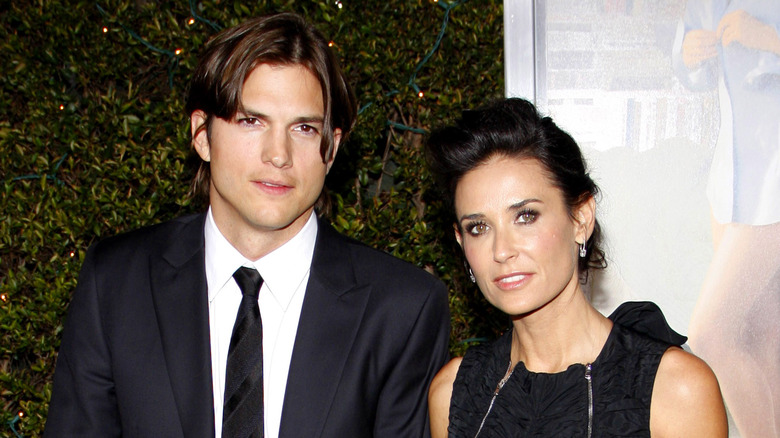 Ashton Kutcher and Demi Moore pose for the camera