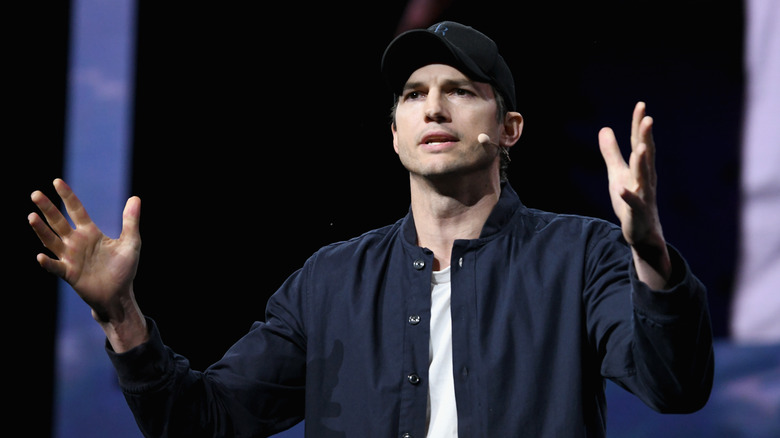 Kutcher speaking at an event