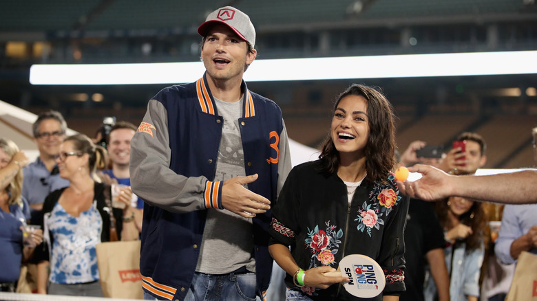 Kutcher and Kunis participating at a charity event