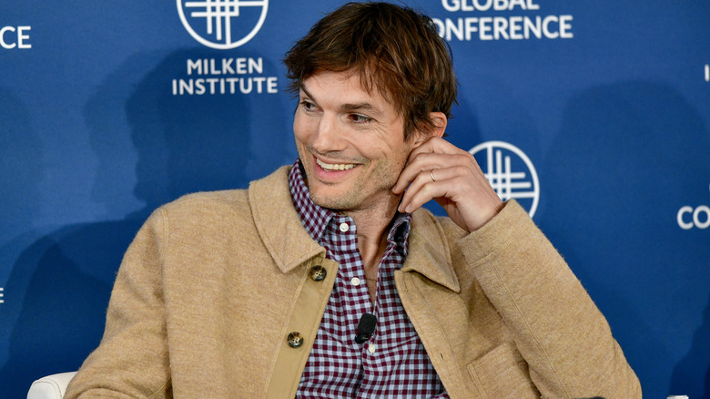 Ashton Kutcher laughing at global conference interview