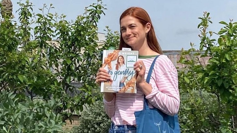 Bonnie Wright holding her book