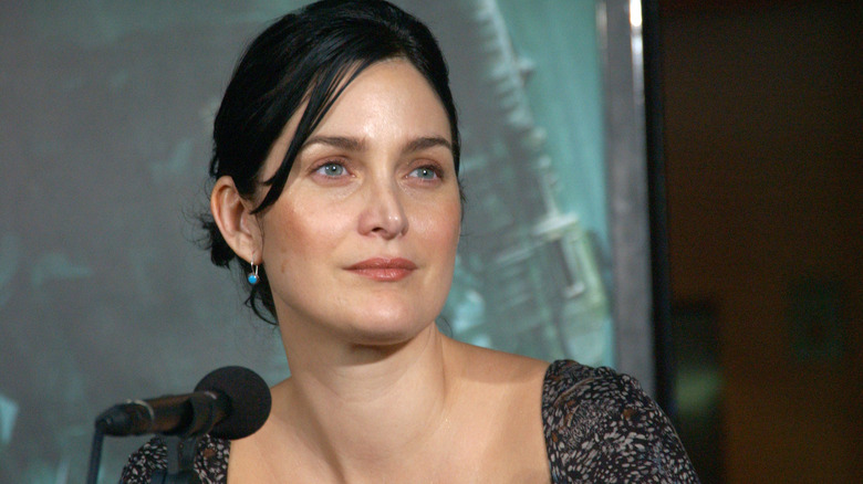 Carrie-Anne Moss answers question at The Matrix 3 conference