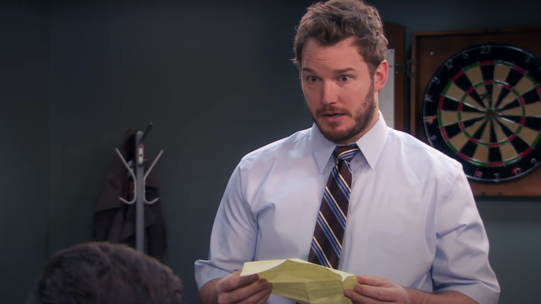 Andy Dwyer holding paper