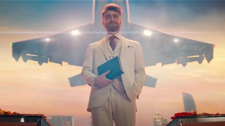 Radcliffe, white suit, airplane overhead