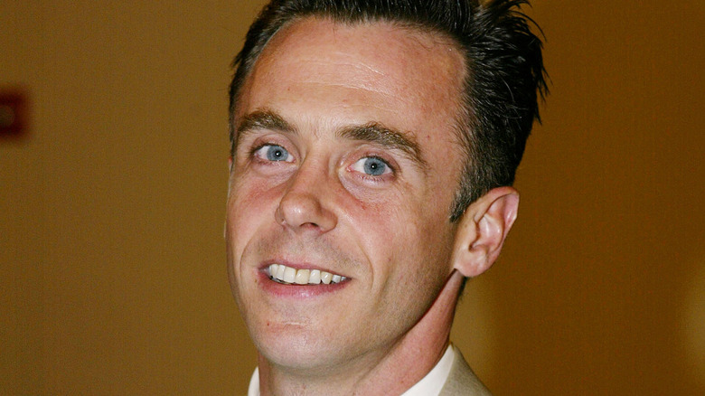 Young David Eigenberg smiling