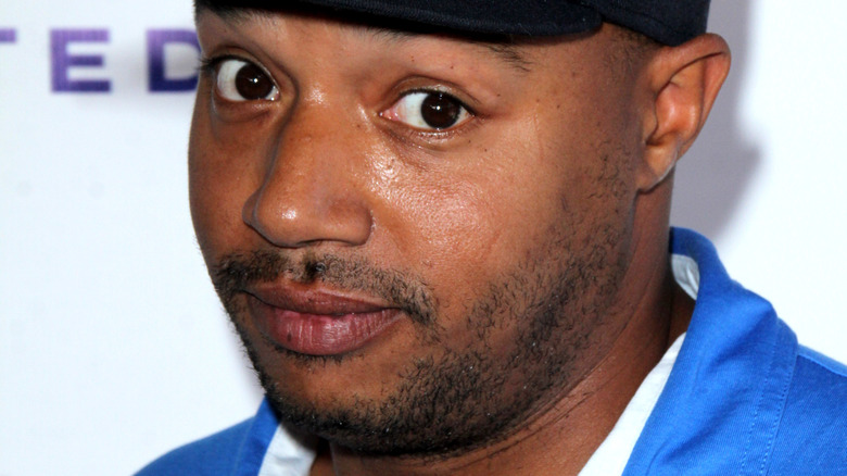 Donald Faison wearing a hat