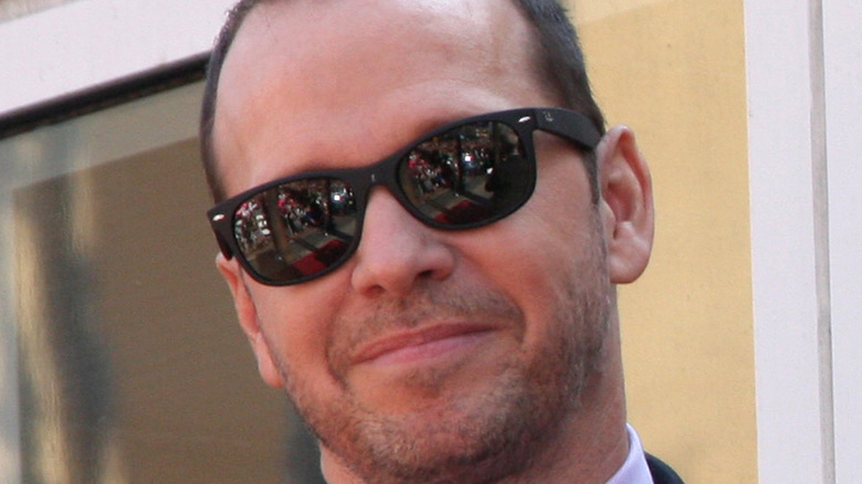 Donnie Wahlberg smiles in sunglasses