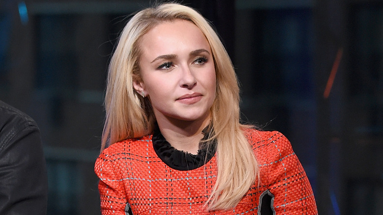 Hayden Panettiere holds a microphone