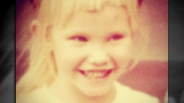 Young Kelli Giddish smiling 