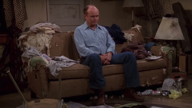 Red Foreman on a busted couch