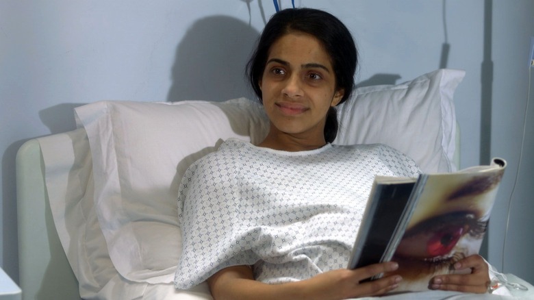 Mandip Gill in hospital gown on Doctors as Shazia Amin