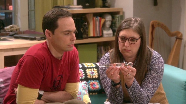 Amy and Sheldon sat on couch