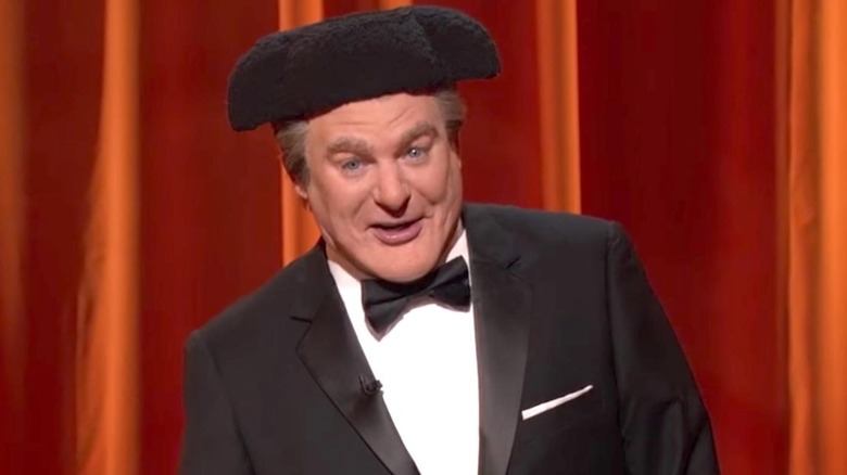 Mike Myers as Tommy Maitland hosting "The Gong Show"