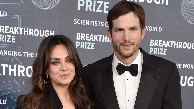 Mila Kunis and Ashton Kutcher pose for photos