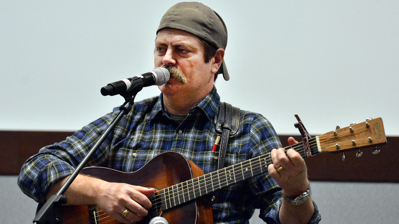 Nick Offerman plays guitar