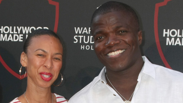 Reno Wilson and wife