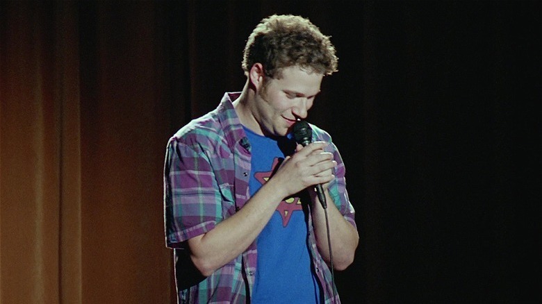 rogen holding microphone