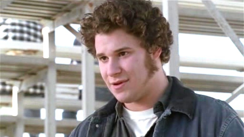 Seth Rogen in freaks and geeks, standing under bleachers