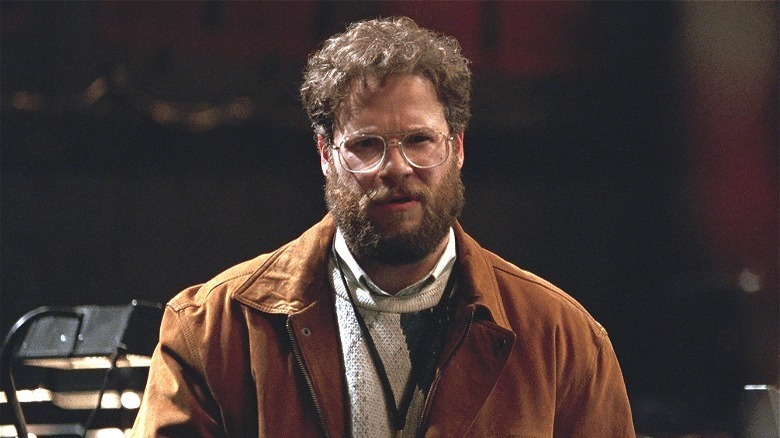 Seth rogen in glasses and brown jacket