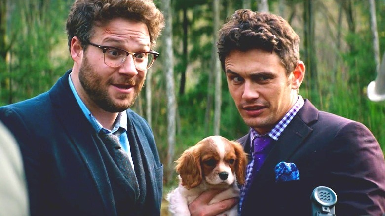 rogen and franco with puppy