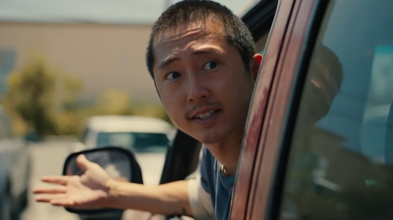 Danny Cho arguing out of his car window