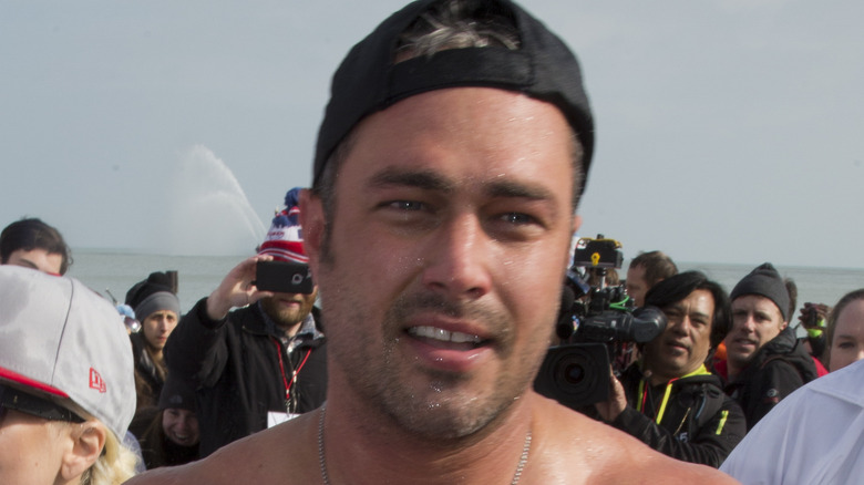 Taylor Kinney on beach