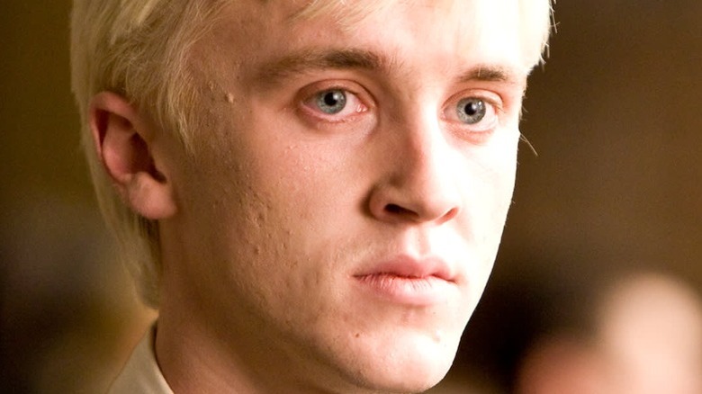 Draco Malfoy looks haunted