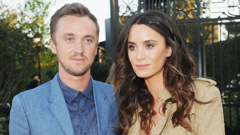 Tom Felton and Jade Gordon smile