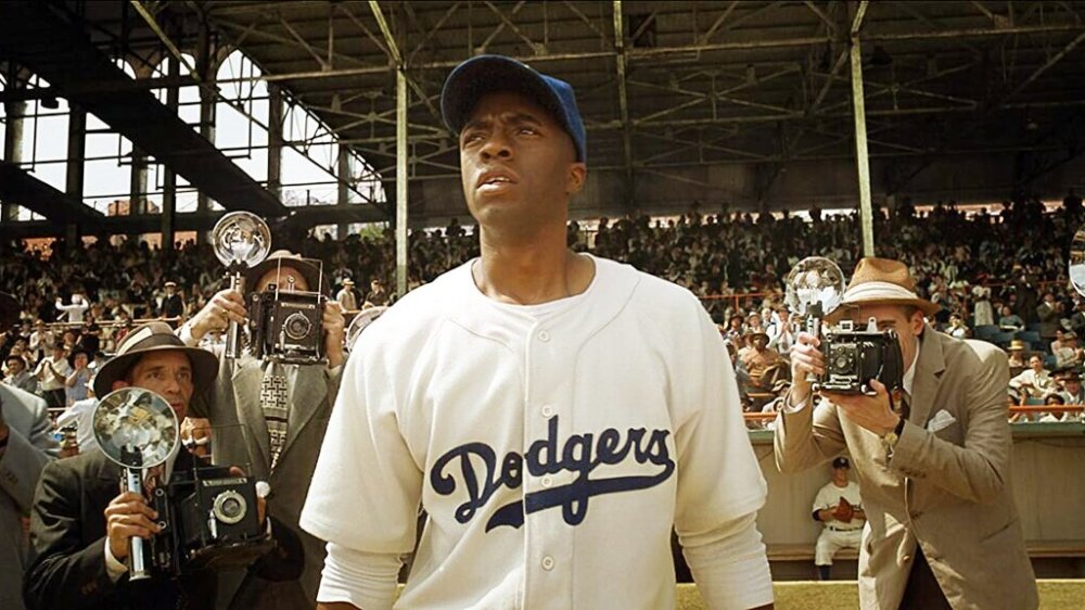 Chadwick Boseman as Jackie Robinson in 42