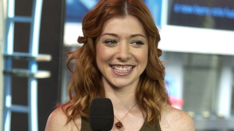 Alyson Hannigan holding microphone