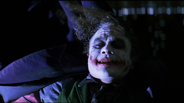 The Joker hanging upside-down