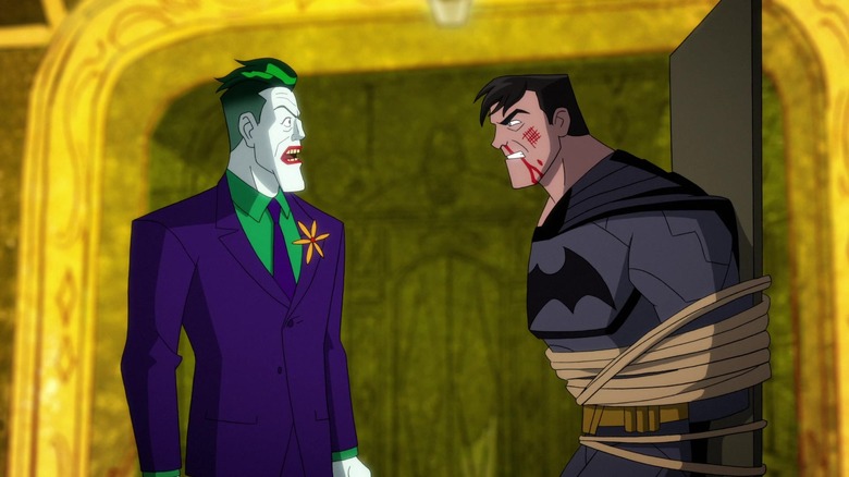 The Joker unmasking Batman