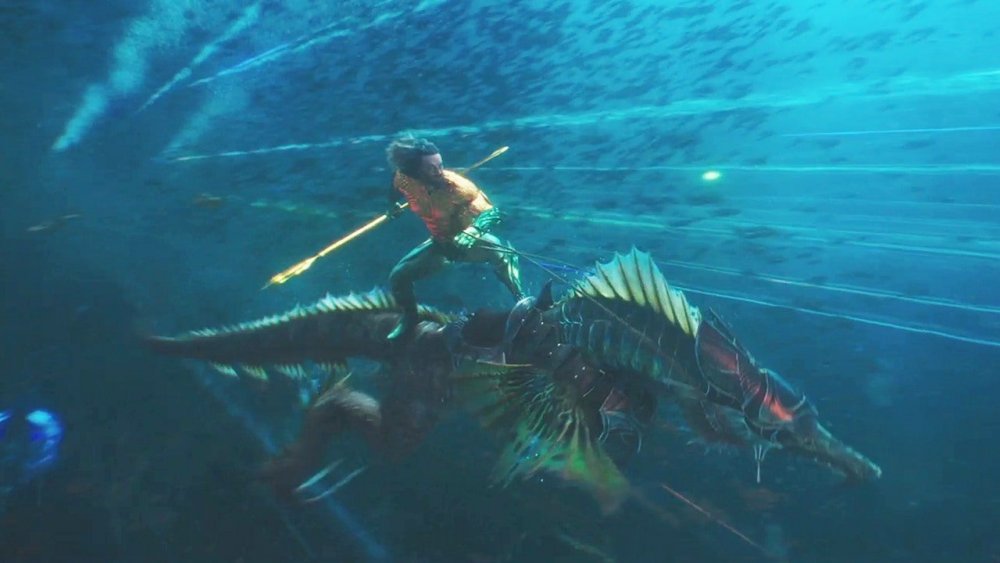 Aquaman riding seahorse creature