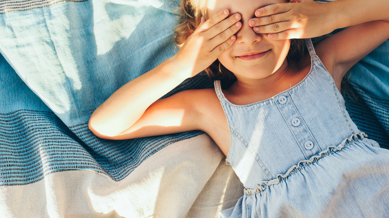 Child playing peekaboo