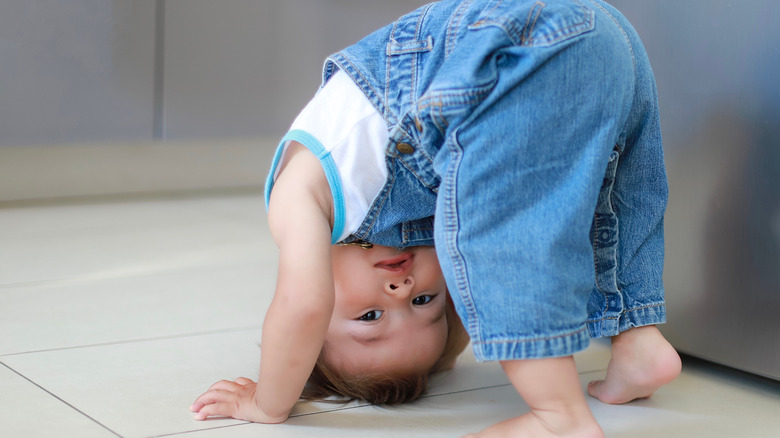 Baby looking upside-down