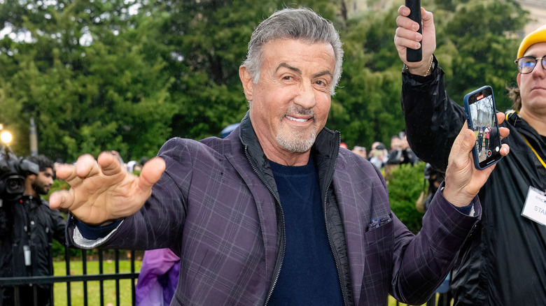 Sylvester Stallone extends his hand