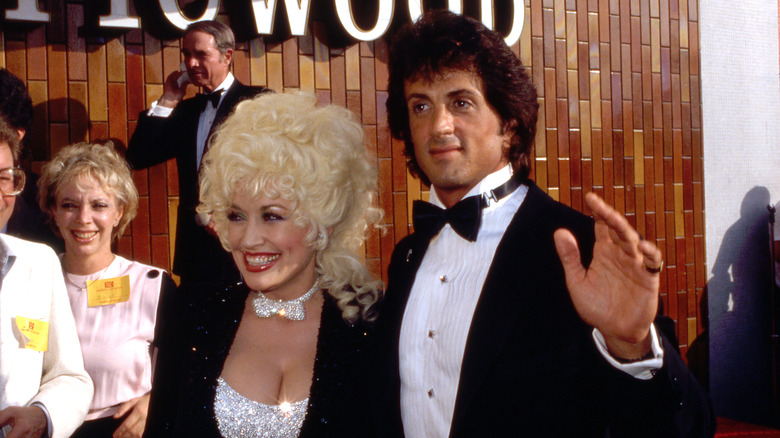 Sylvester Stallone and Dolly Parton smiling