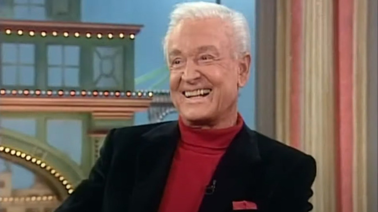 Bob Barker smiling on the set of a talk show