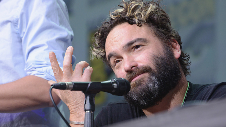 Johnny Galecki with hand up