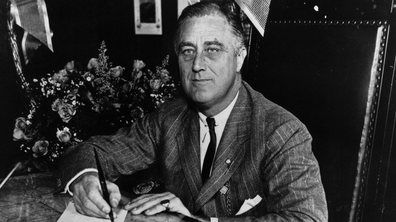 Franklin Roosevelt writes on paper