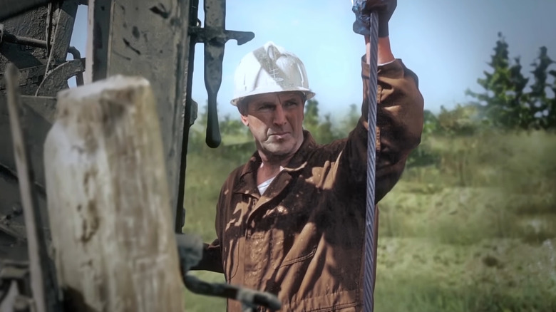 Dan Blankenship hangs on wire