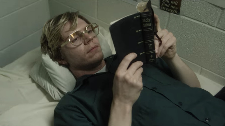 Evan Peters reading the bible in prison