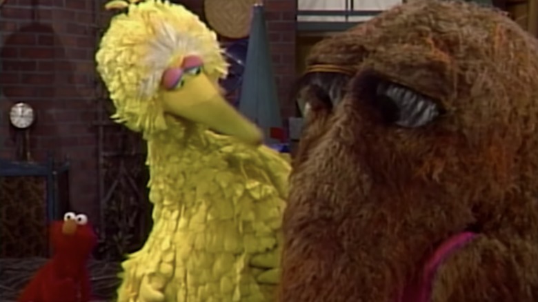 Elmo, Big Bird, and Snuffleupagus on Sesame Street when everyone finally meets Snuffy