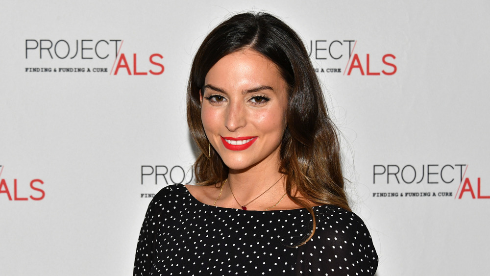 Genesis Rodriguez smiling at a formal event