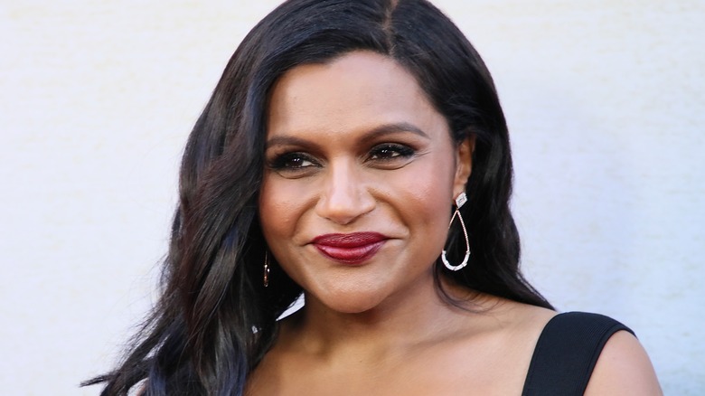 Mindy Kaling smiling back dress