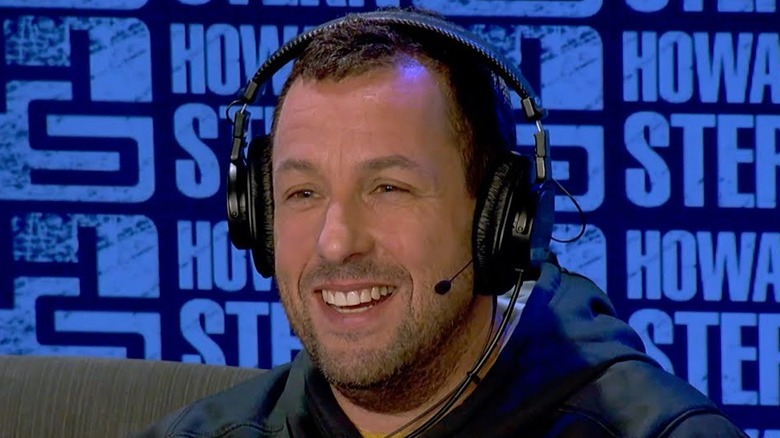 Adam Sandler in headphones