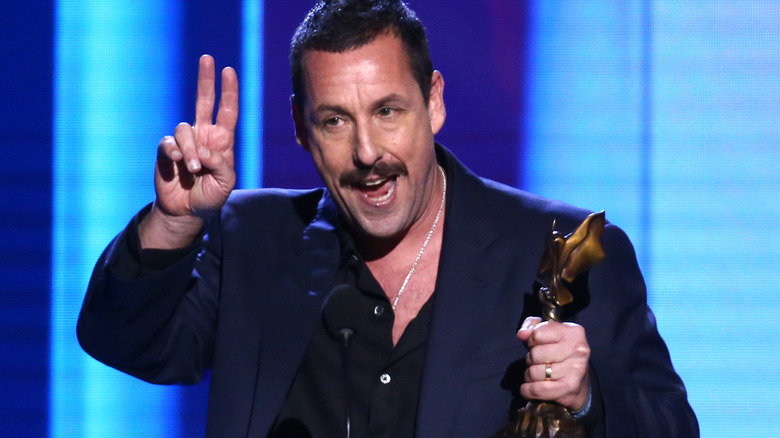 Adam Sandler giving peace sign